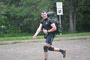 Lieutenant Stephen “Saskatoon Ink” Couture is proudly displaying his tattoo and proper hand positioning for drill while he ruck runs towards the awaiting canoes.